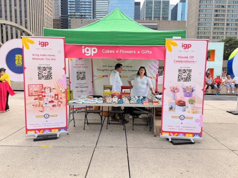 The igp booth at Panorama India, Nathan Phillips Square, Toronto, with brand ambassadors behind the product table